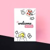 The "Welcome Words" cardgame box in white on a pink and black background. The box shows the logo in the center, illustrations of plates and hands grabbing photographed food from them, in two corners.