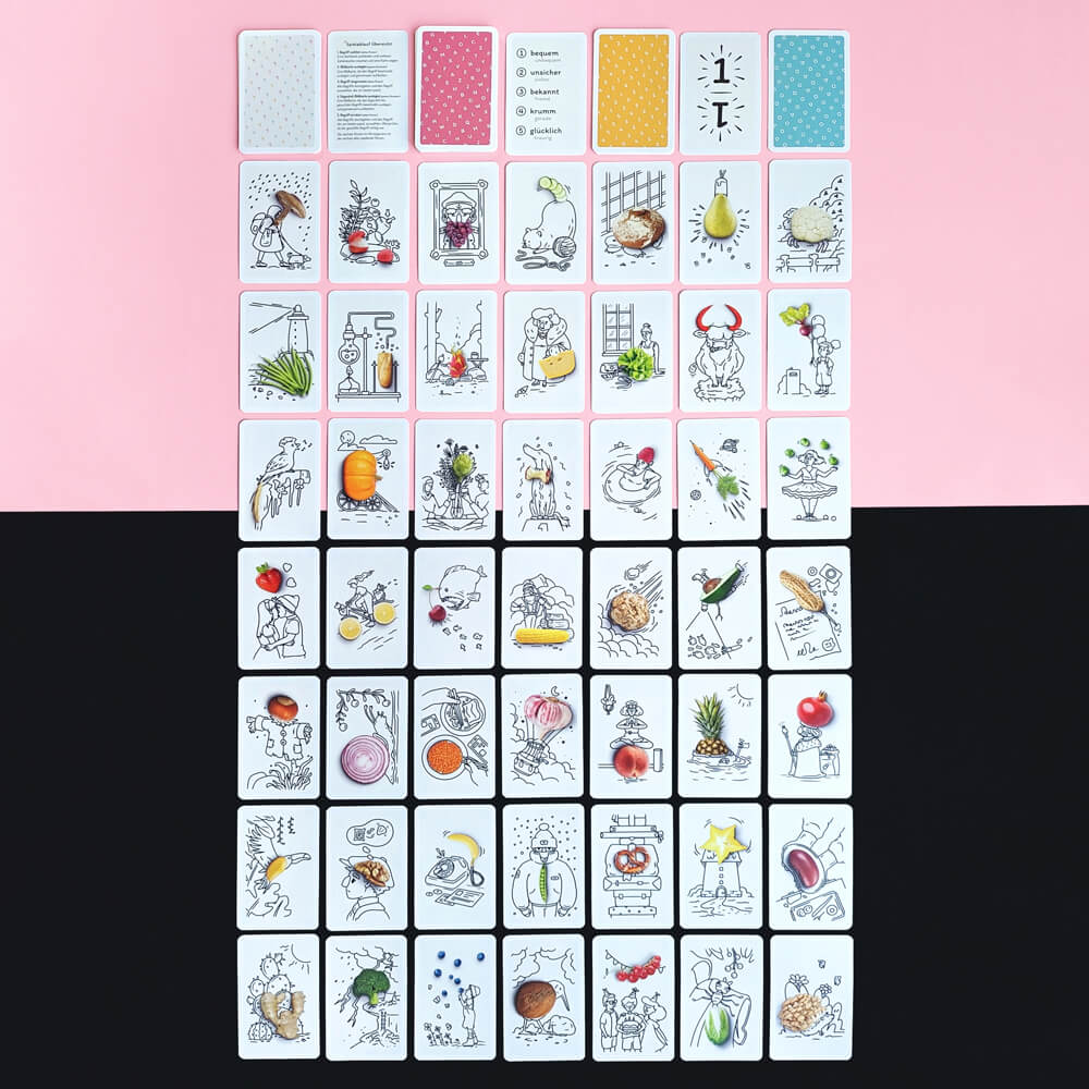 All 79 cards of Welcome Words layed out in a grid. Mostly displaying the illustrated picture cards.